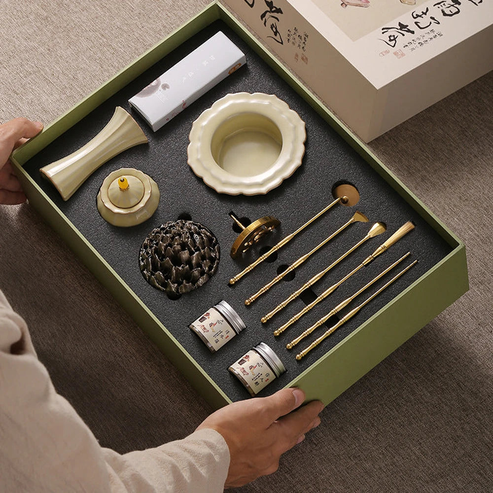 The Celadon Incense Ritual Gift Set with pale ceramics, brass tools and illustrated packaging