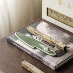 Mountain-shaped green incense holder with illustrated incense packs and gift box