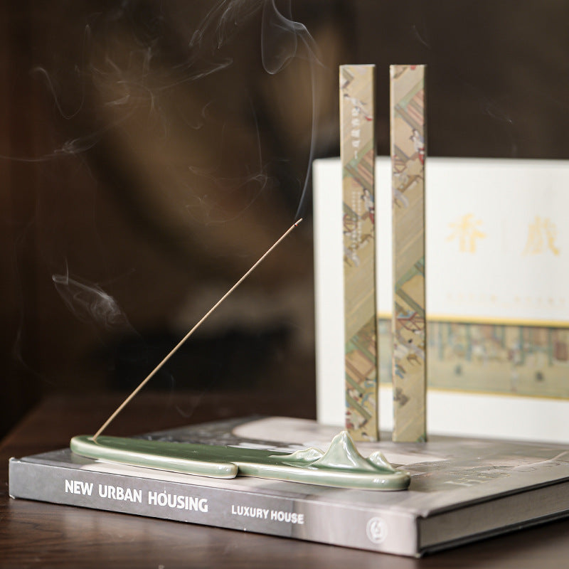 Close view of the green mountain incense holder and incense packs