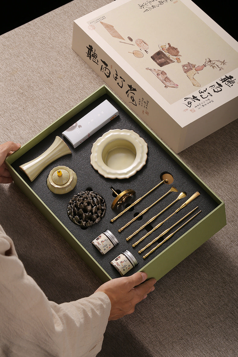 Open celadon gift box showing the complete incense tool set