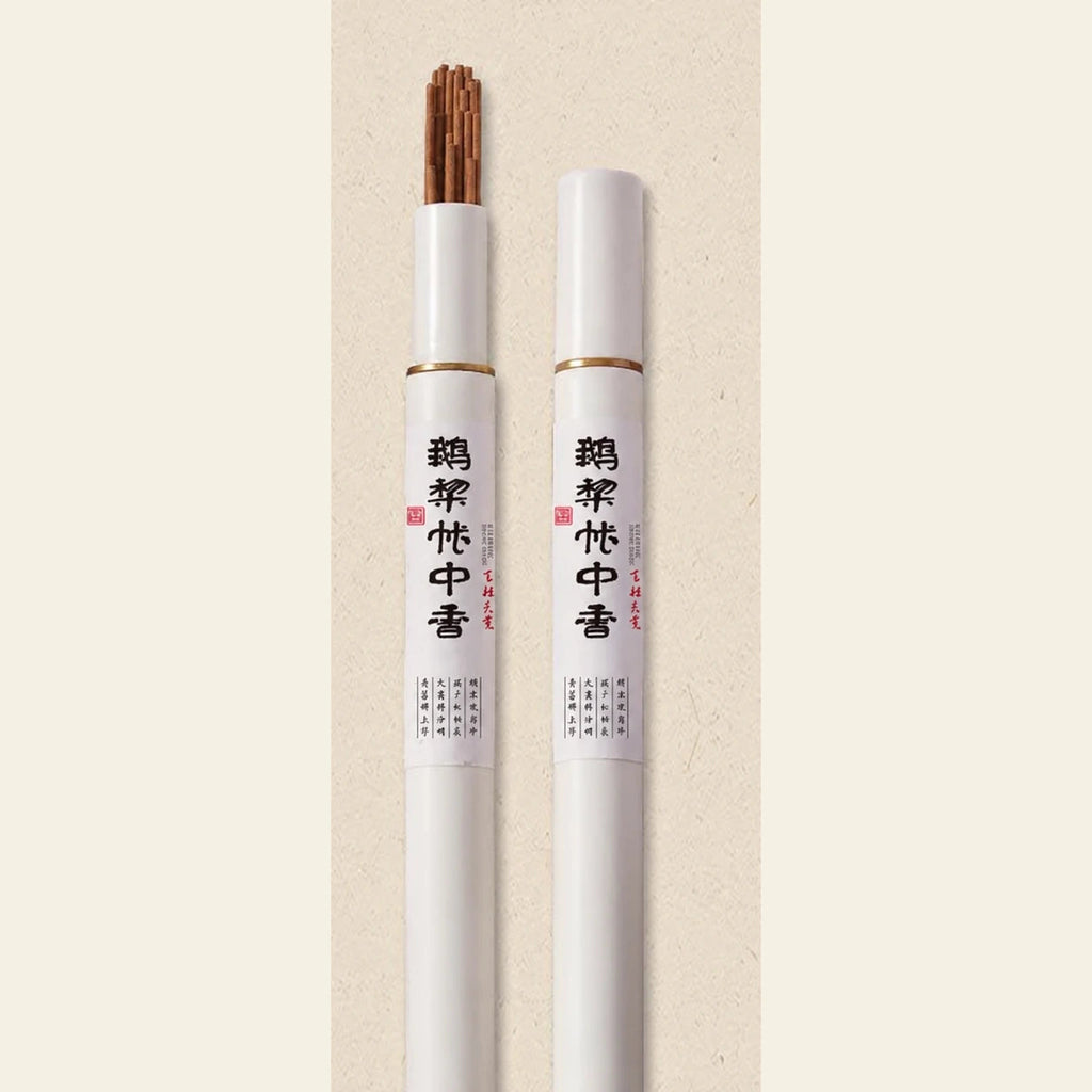 Traditional Blend incense sticks in original white tubes on a warm cream square background
