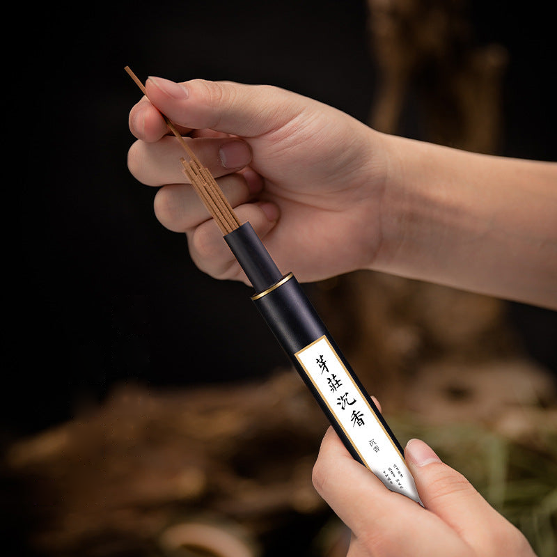 Dispensing sticks from a black incense tube