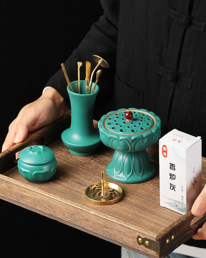Jade Green Lotus ritual kit with ceramic vessels and brass tools on a wooden tray