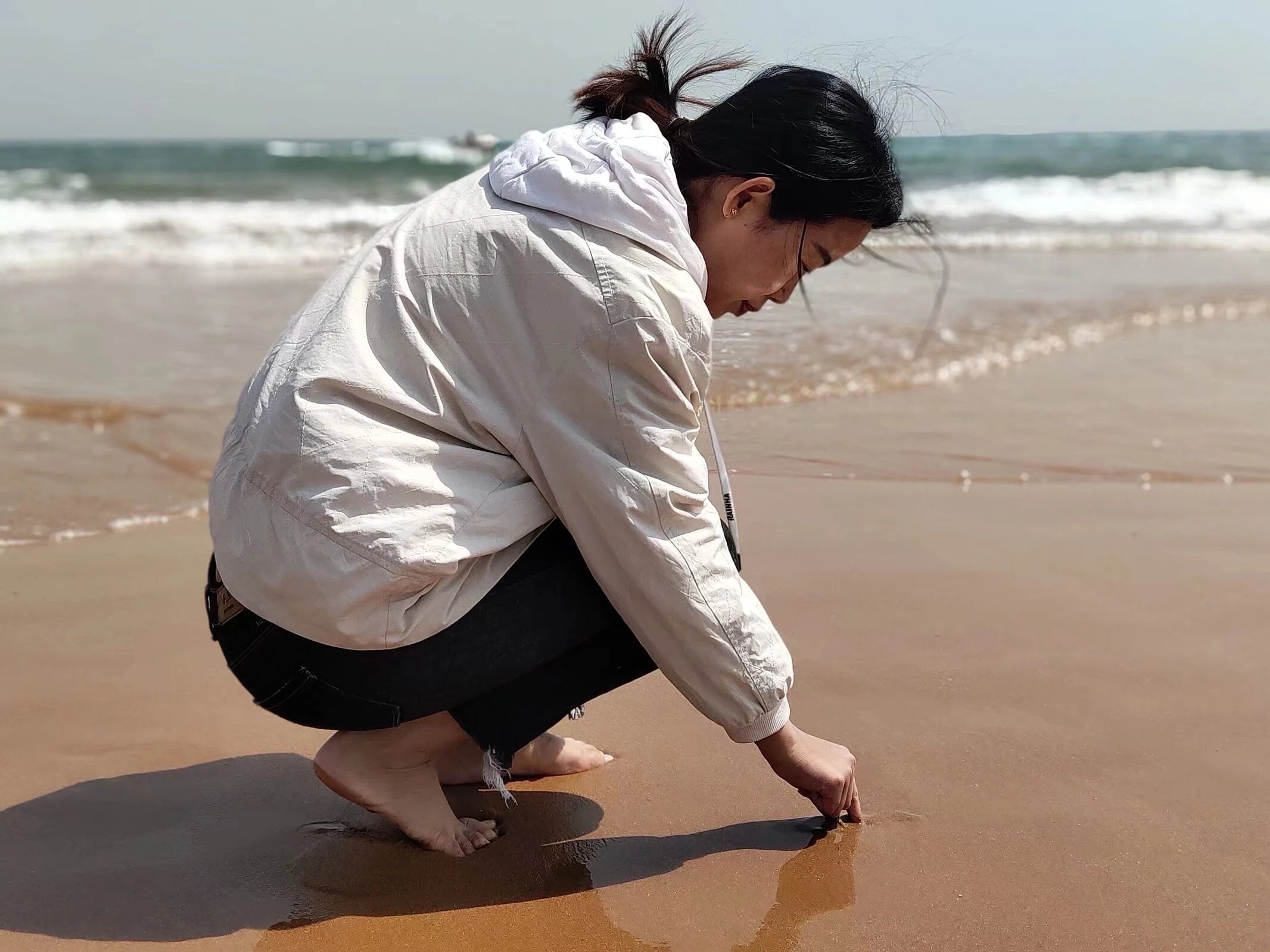 Dana Gao, founder of Ash & Lotus, by the sea